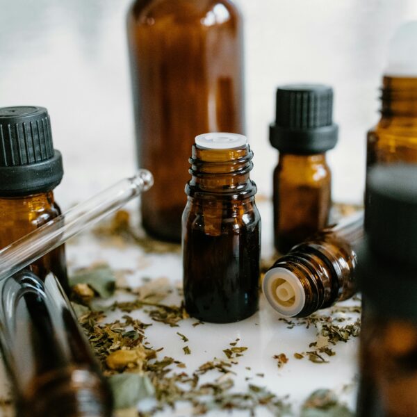 A close-up of amber bottles with essential oils, showcasing natural healing properties.
